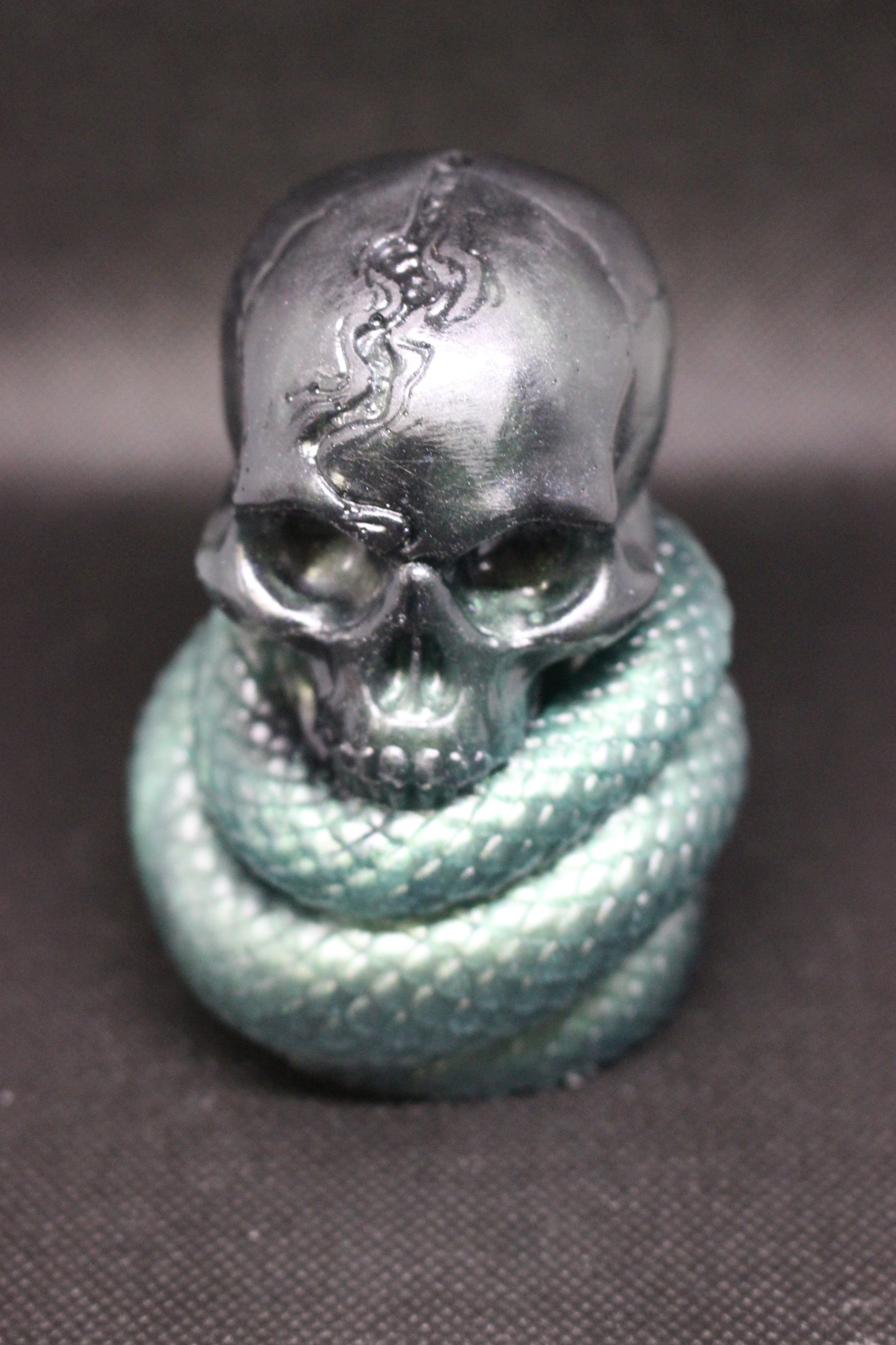 Skull and snake resin decor