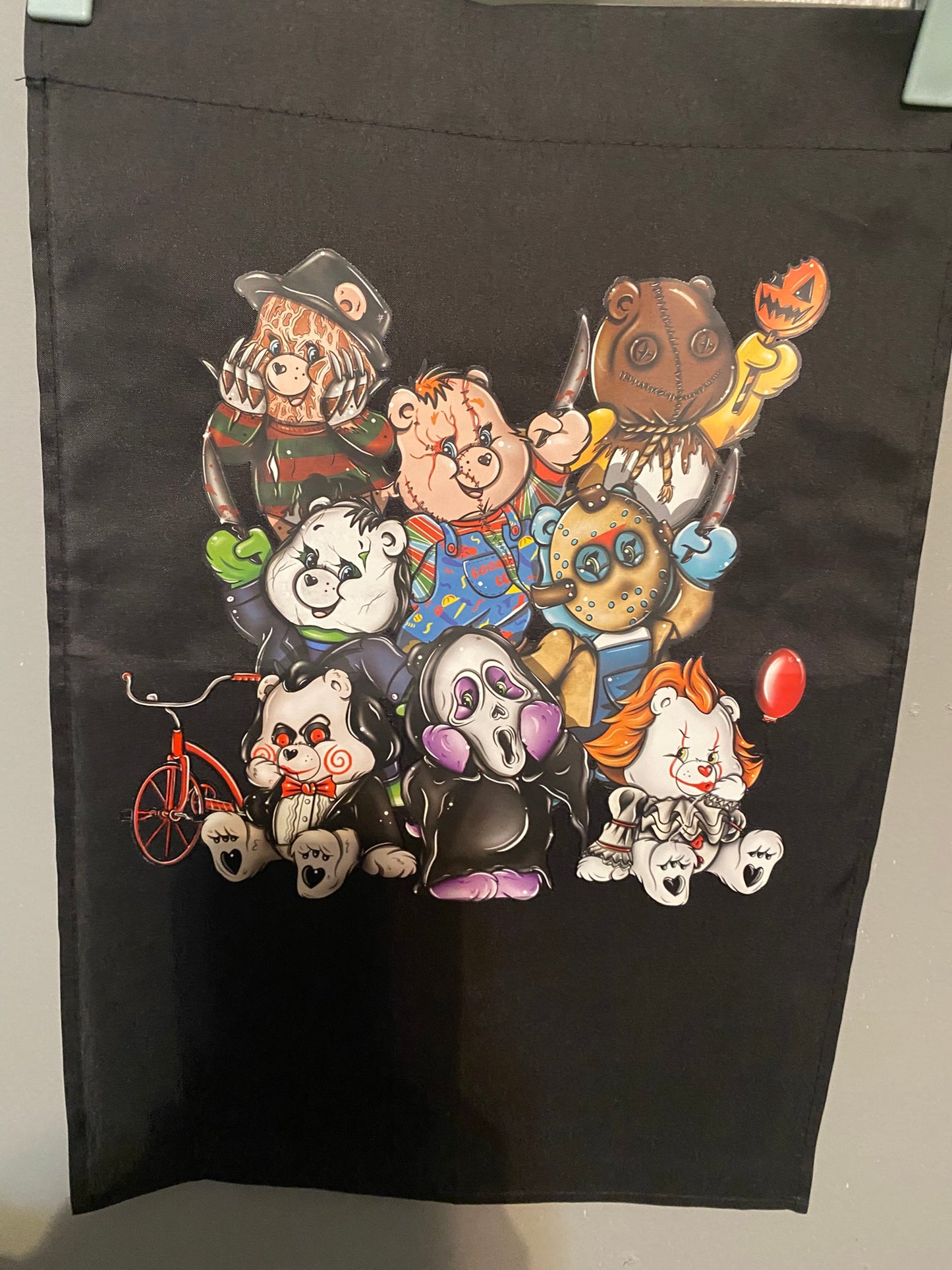Horror film bear Garden Flag for Outdoor Decor Delight features iconic horror characters, perfect for spooky outdoor vibes.